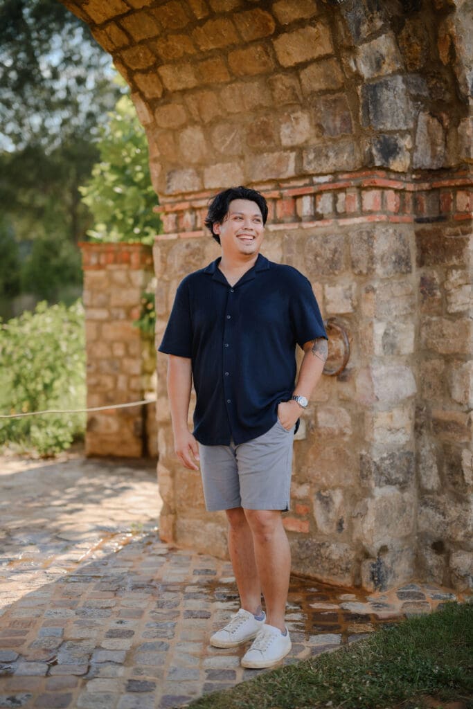 Relaxed portrait of dad at BridgeWay Station during a family photography session in Greenville, South Carolina.